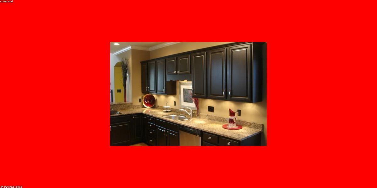 Renovated kitchen cabinets with modern hardware and fresh paint